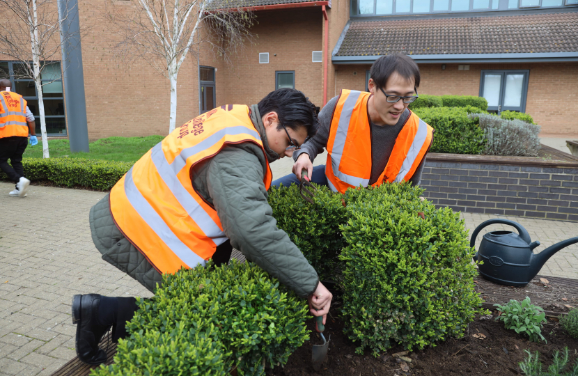 Johnny planting with Gabriel