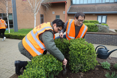 Johnny planting with Gabriel